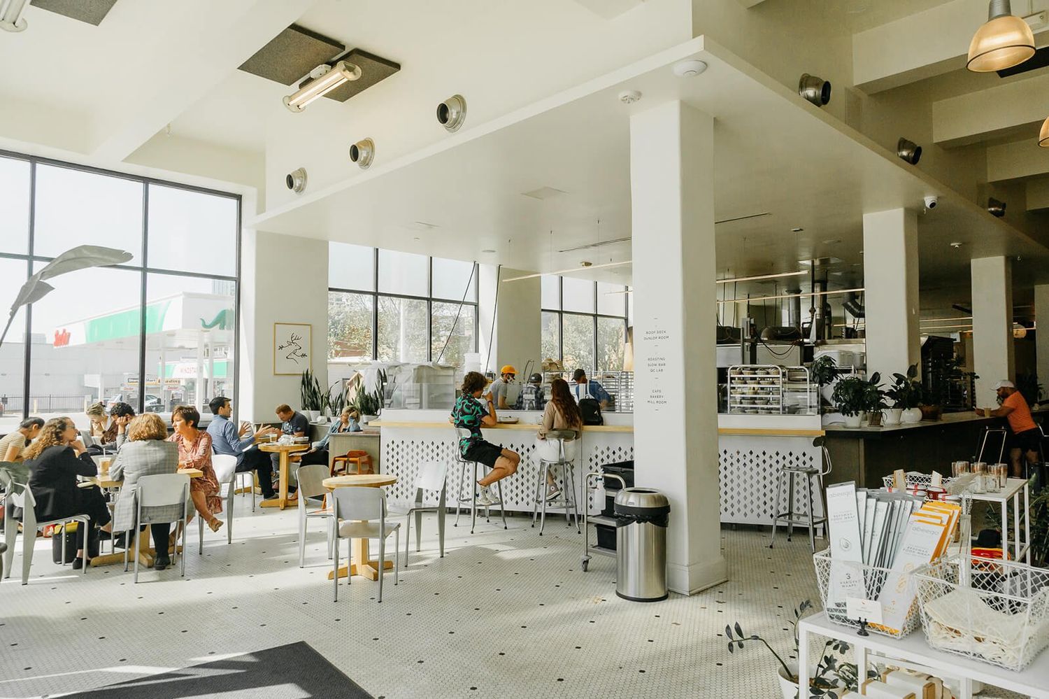 Bright café dining room with a bakery counter
